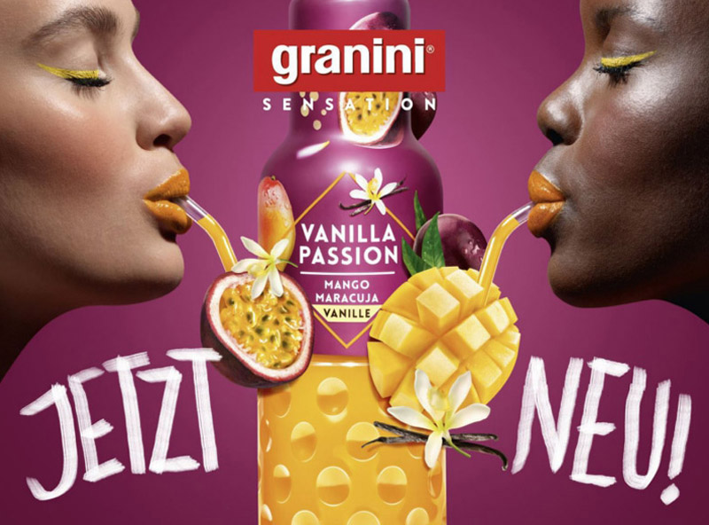 Plakatmotiv der Marke granini mit zwei Frauen und der Getränkesorte „Vanilla Passion“ mit Mango, Maracuja und Vanille sowie dem Hinweis „Jetzt neu“.